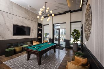 A pool table in the lobby of a hotel